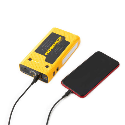 Hummer HX Pro jump starter in use in a car